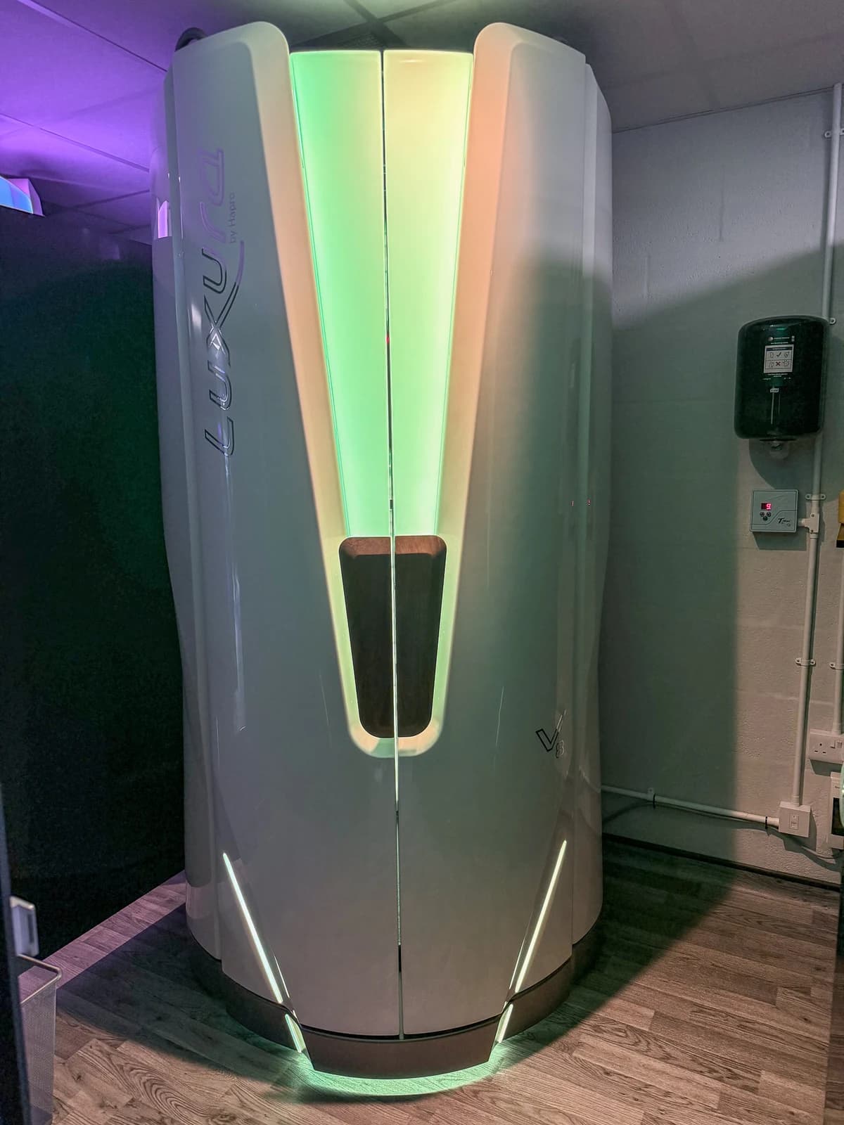 Luxura V8 cabin closed with green light spill from the top arc