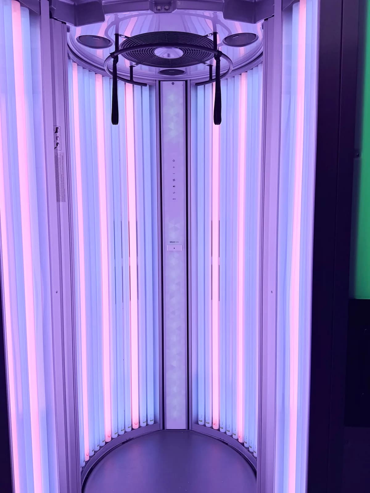 Inside the Luxura V8 with door open and lamp banks lit